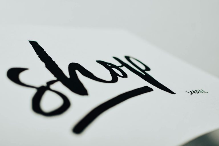 Close-up of a handwritten sign promoting support for small businesses.